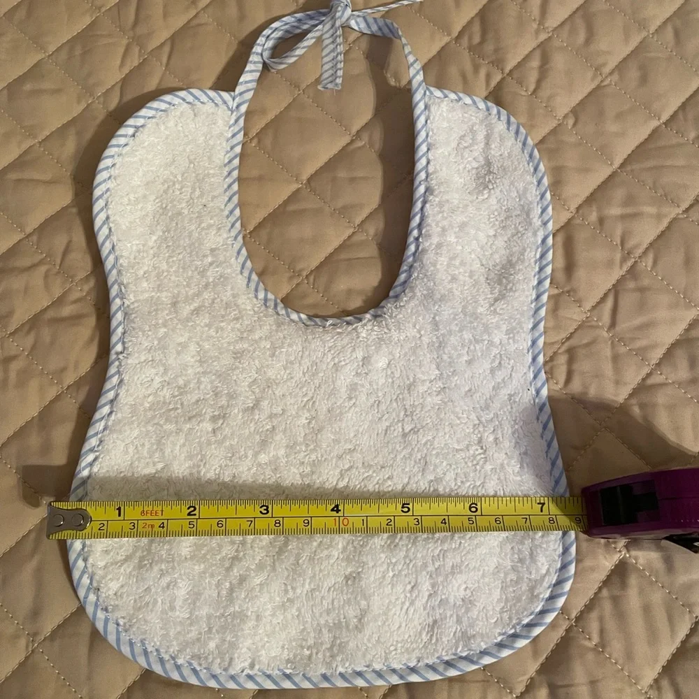 Handmade Bib white with blue trim, tie closure, brand new.